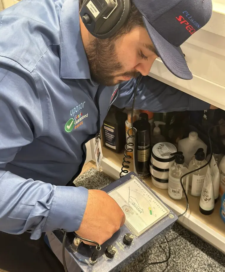 Professional pipe locating equipment used during leak detection service