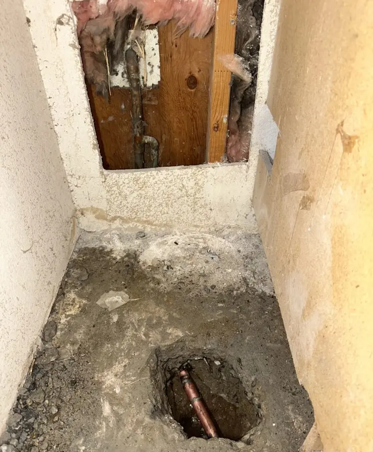 Access opening for professional slab leak repair on a water pipe