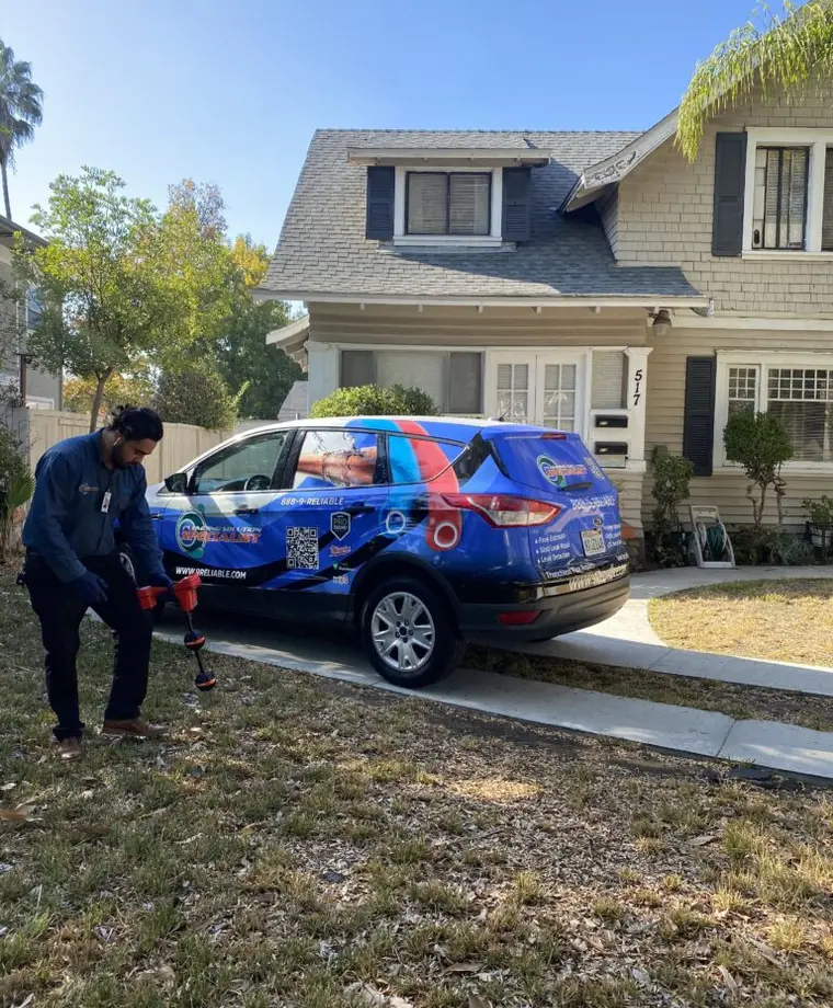 Technicians testing and locating an underground water line leak